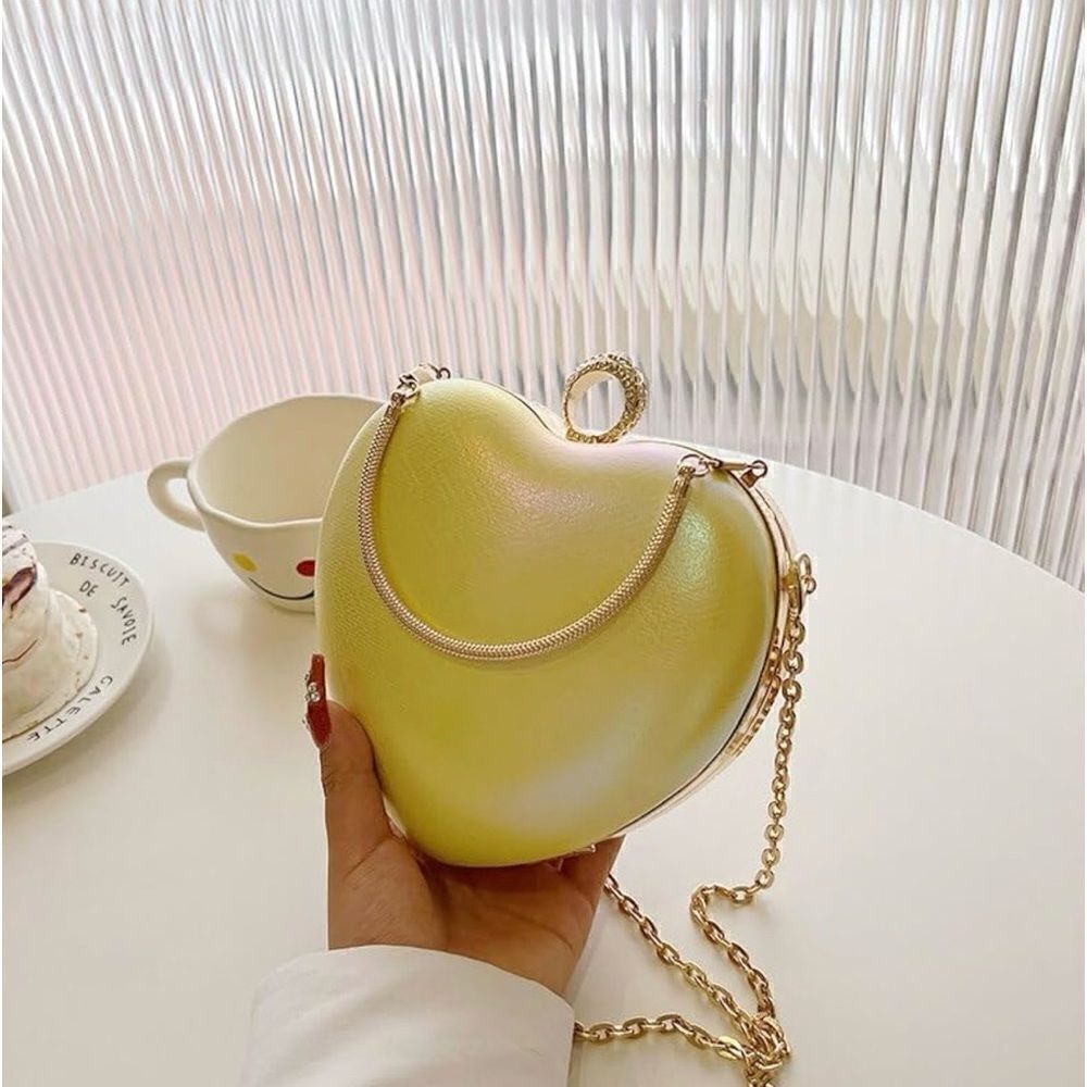 Yellow iridescent heart-shaped purse handbag